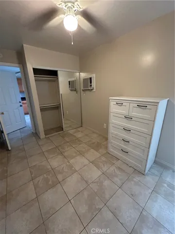 Bedroom with Fanlight and Mirror Closet