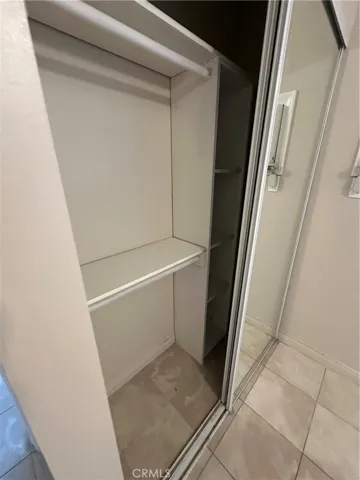 Bedroom Closet with Mirrored Doors