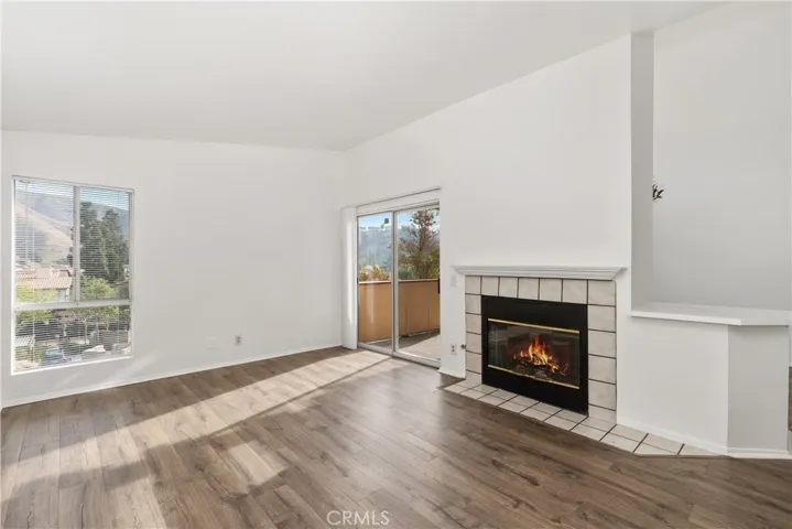 Spacious layout with abundant natural light and a fireplace feature.
