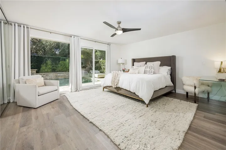 Primary Bedroom with sliders to pool