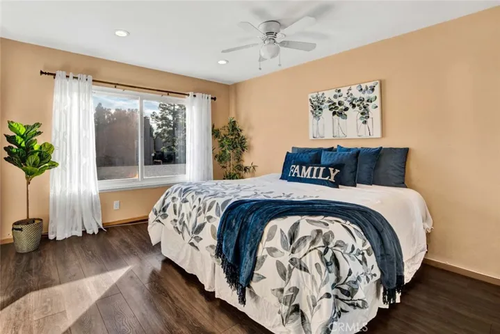 Bright master bedroom with mirrored wardrobe