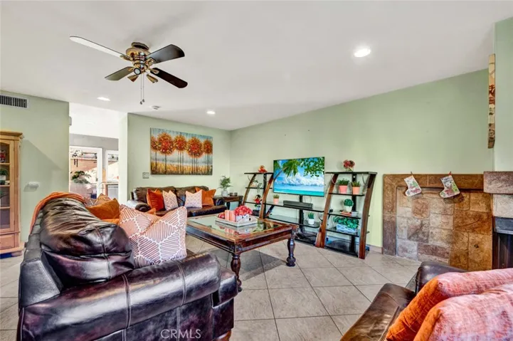 Living room with tons of natural light, smooth ceilings and recessed lighting