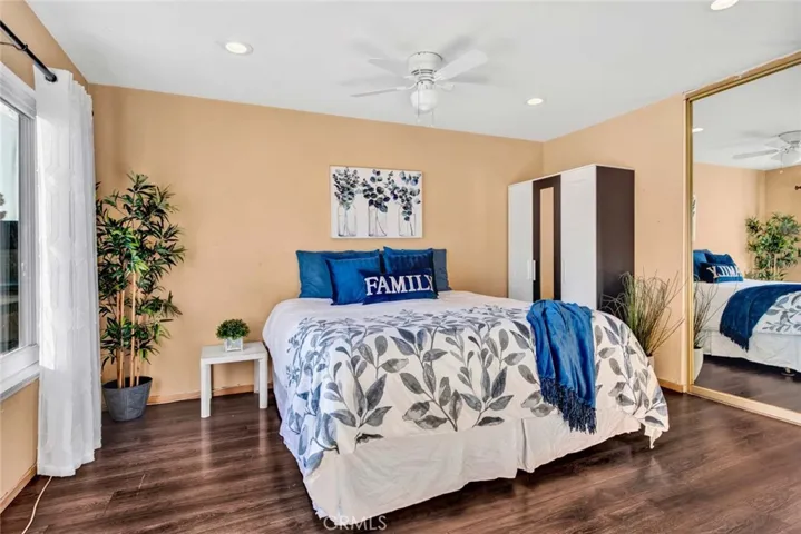 Spacious master bedroom with mirrored wardrobe