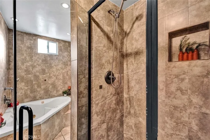 First floor bathroom with separate soaking tub and shower