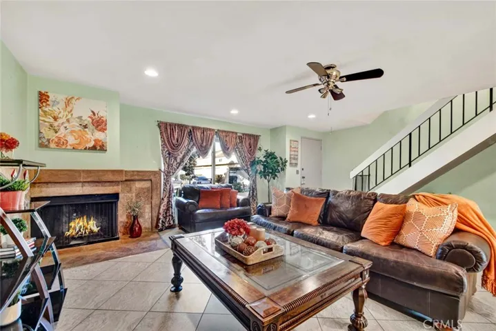 Large living room with room for formal dining under stairs