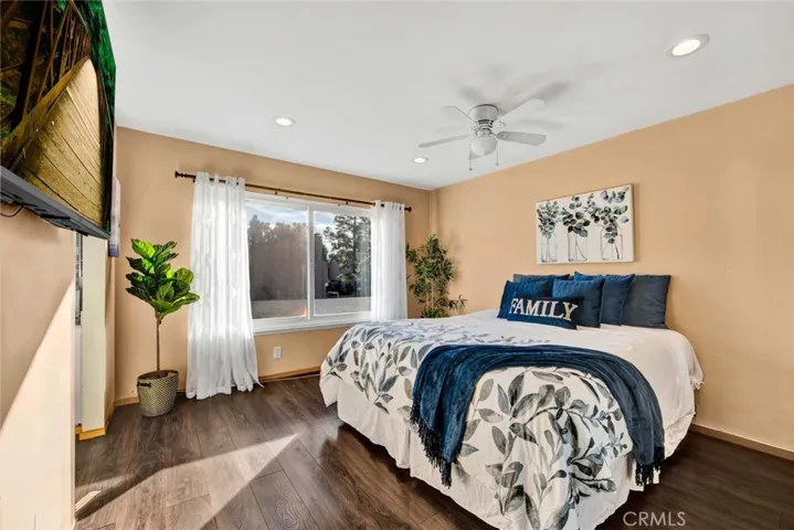 Bright master bedroom with mirrored wardrobe
