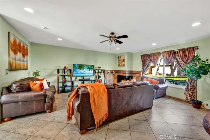 Living room with tons of natural light, smooth ceilings and recessed lighting