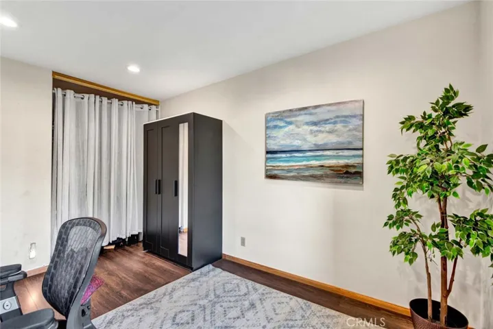 Spacious third bedroom currently used as an office