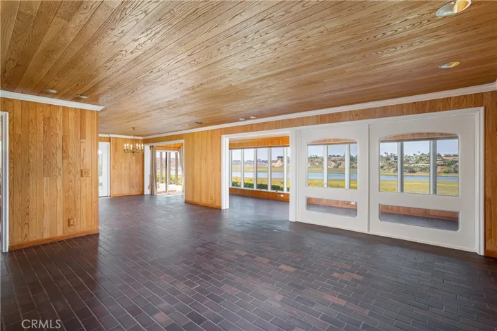 Living Room with Dining and Sun Rooms beyond
