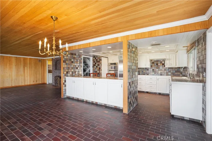 Dining Room with Kitchen and Living Room Beyond