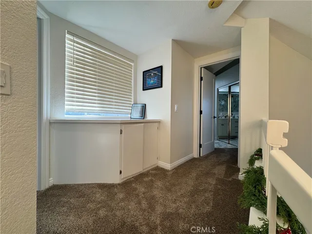 Upstairs hall. Primary bedroom is to the right and the secondary bedroom is to the left. Both bedrooms have their own private bathrooms.