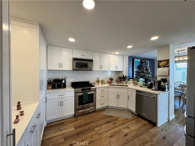 Completely remodeled kitchen with all stainless steal appliances and cute breakfast bar in-between the formal dining area.