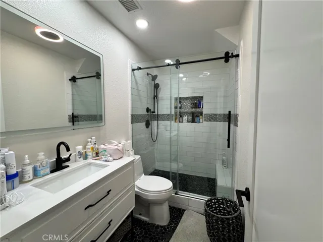 This is the private bathroom for the secondary bedroom. As you can see they are all beautifully remodeled!