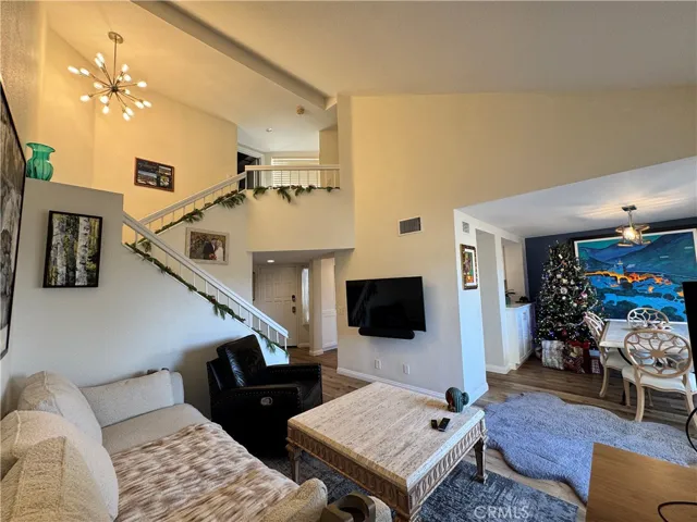Great view showing you the layout of the downstairs living space. Guest bathroom and inside laundry is located to next to the front door under the stairs.