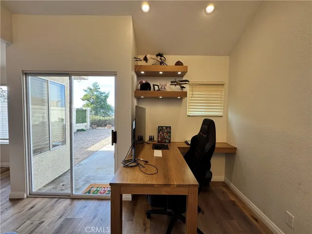 Desk nook next to main living area great for at home office or study area.