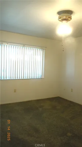 Primary bedroom with views to backyard.