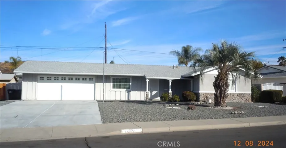 Two car garage and room to park an RV.