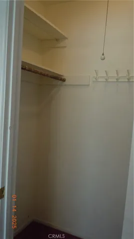 Guest bedroom walk-in closet.