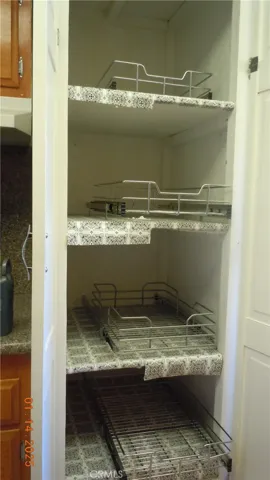 Pantry has pull-out shelving.