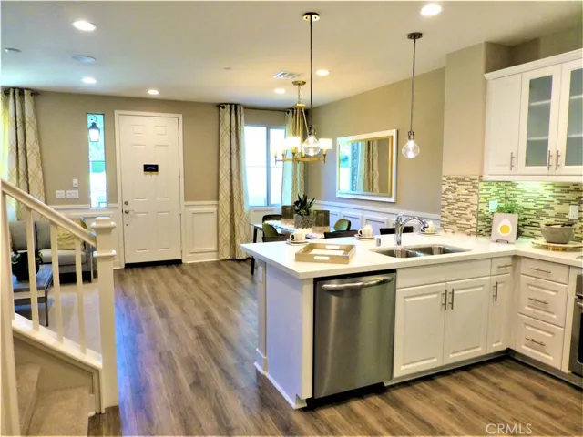 These are photos of the model home so you can have an idea of what to do with it. The subject property has grey cabinets.
