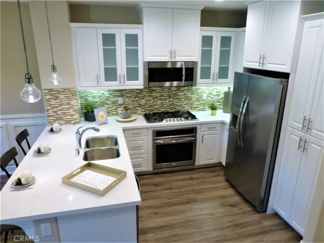 These are photos of the model home so you can have an idea of what to do with it. The subject property has grey cabinets.