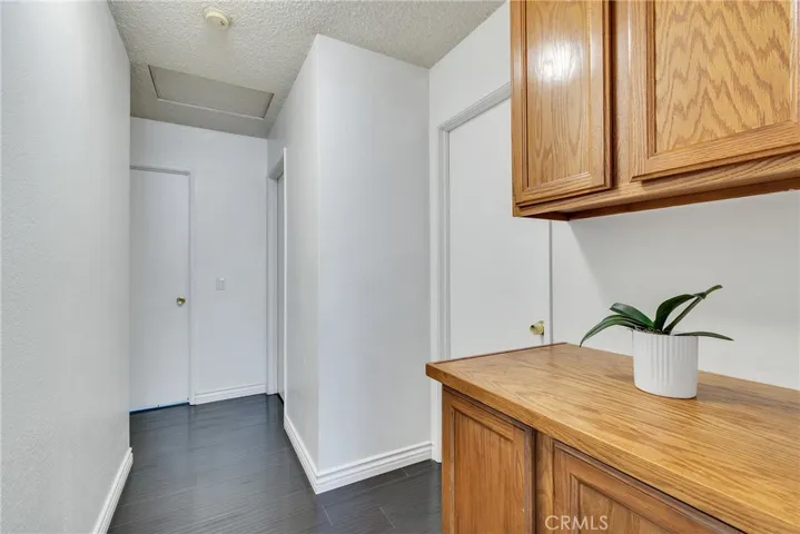 Hallway with linen cabinets