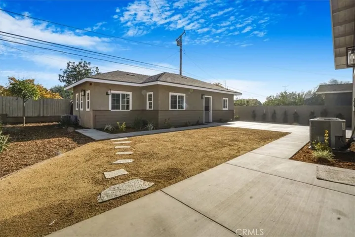 VIEW OF REAR HOME FROM FRONT PATIO