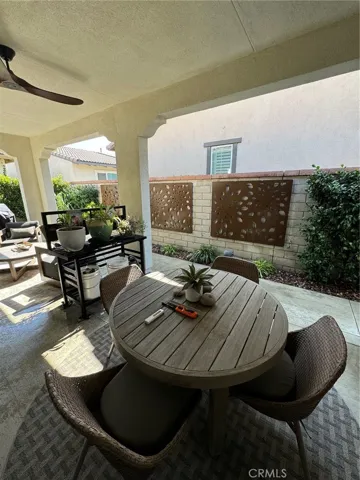 Covered Patio with seating and Dining Space