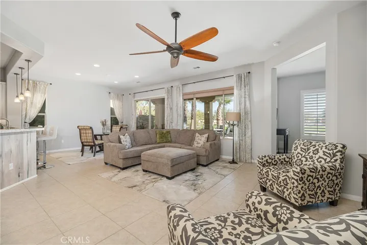 large great room opens to the formal dining room and gourmet kitchen.