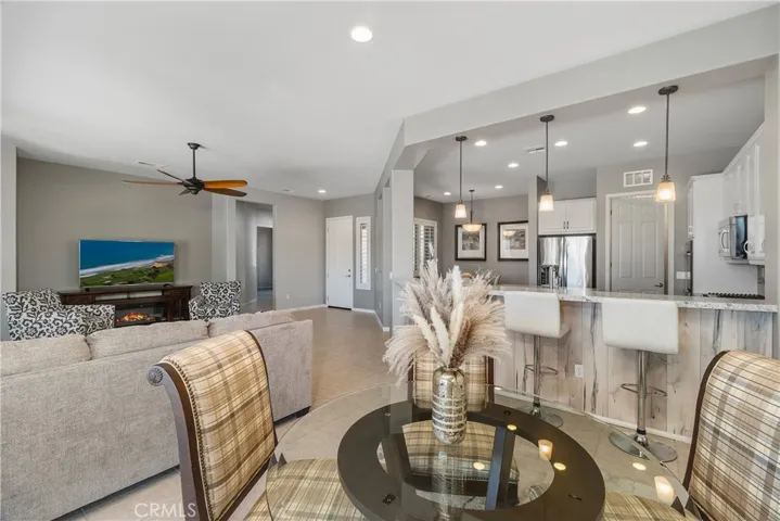 nice kitchen bar area with customized designer flare. quartz counter top, designer pendant lighting.