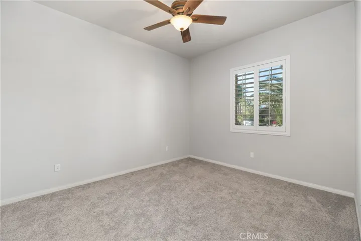 secondary bedroom toward fron of the house. new paint and carpet. large closet.