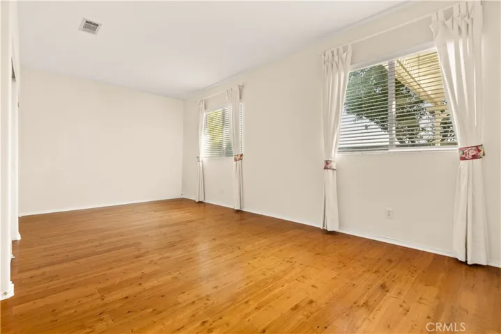 Bedroom 2  or game room with hardwood flooring