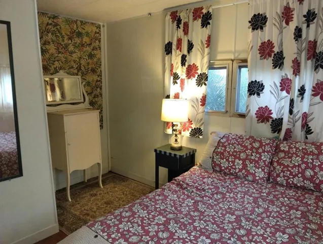 Primary bedroom has nook for dresser or TV stand