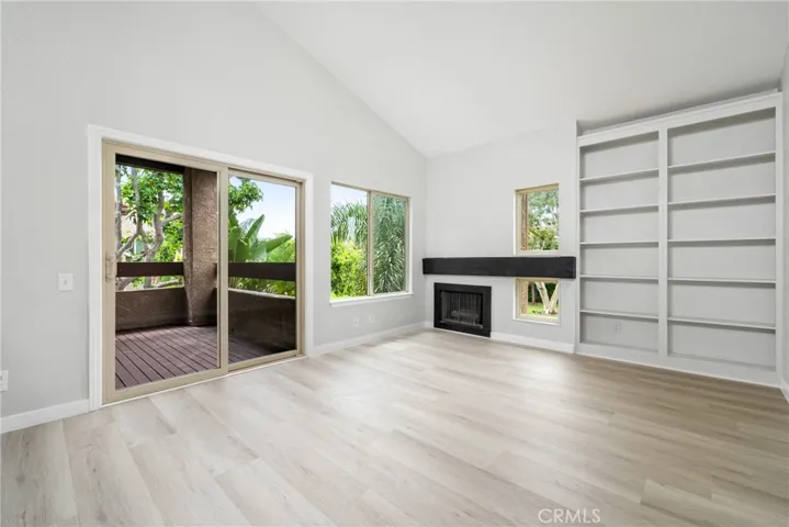Vaulted ceilings, new laminate floors, light fixtures, dual paned slider to private balcony and a gas fireplace!
