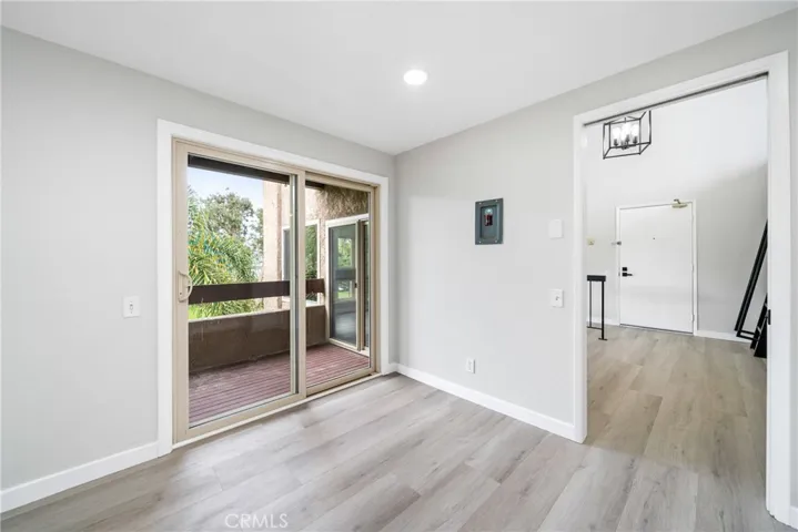 Off the kitchen and dining area there are glass sliding doors to a private balcony!

