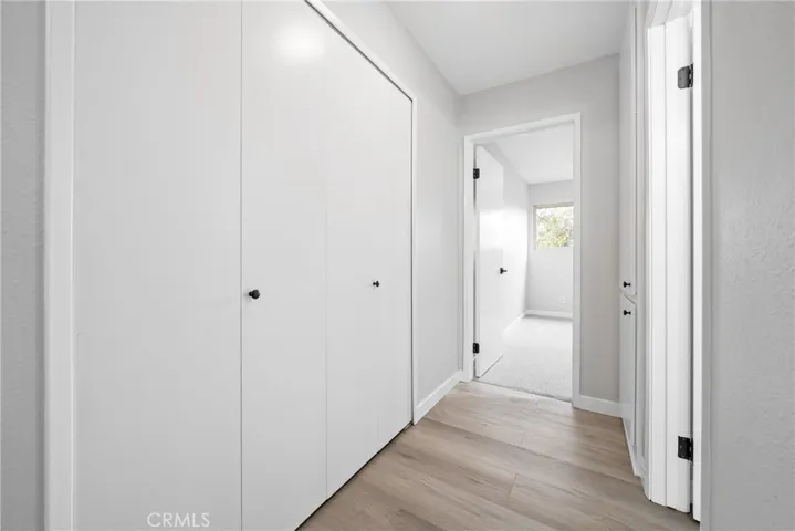 Back inside and down the hall you'll find the primary bedroom and storage closet.
