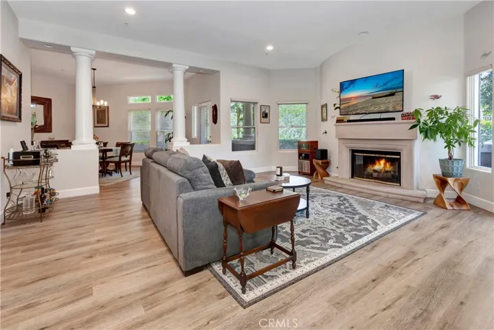 Living room and dining room with view of greenbelt