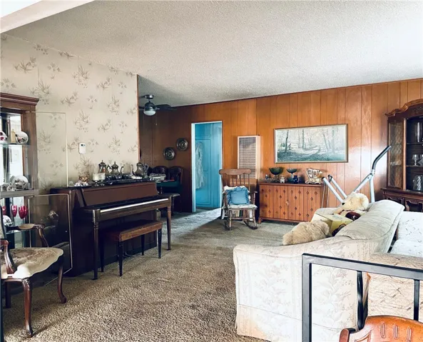 Original living area with dining. Please note items in the photo are part of the Estate Sale