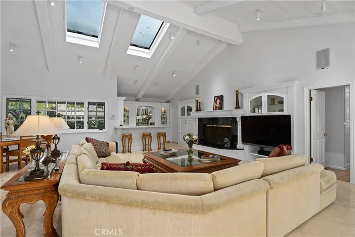 with beam ceiling and a wet bar