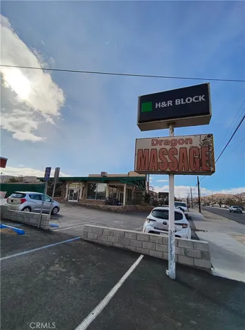 Next to H&R Block and Rocky's Pawn Shop, 29 Palms hwy frontage.
