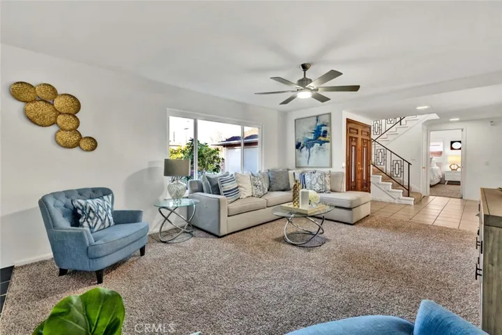 Ceiling Fan and Newer Carpet In Living Room