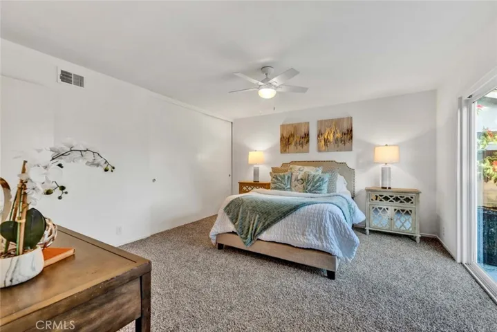 Ceiling Fan And Newer Carpet In Downstairs Master Bedroom