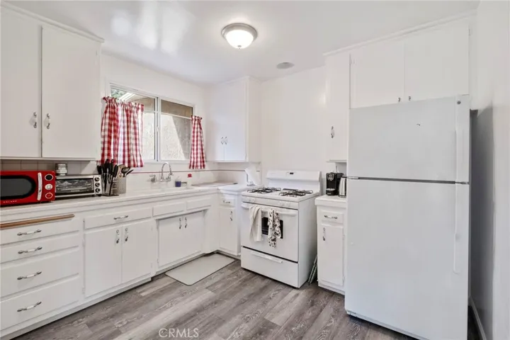 Plenty of Room to Walk Around in this Cute Kitchen.