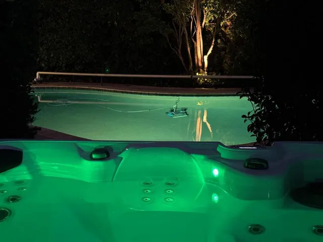 Hot tub and pool at night