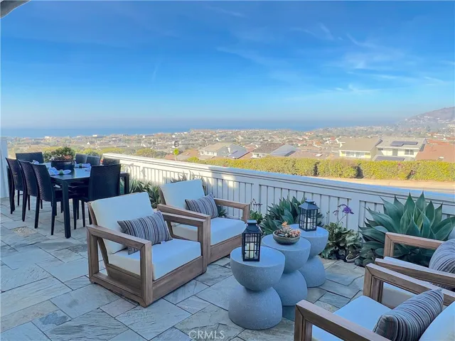Patio with ocean, city and mountain views