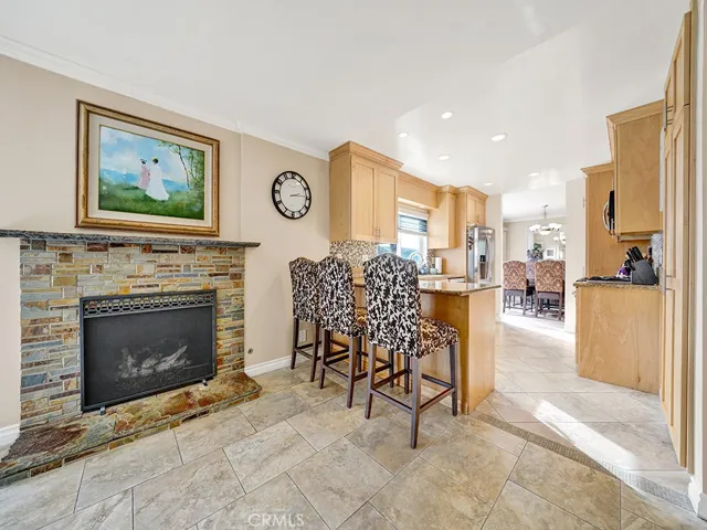 Kitchen with Breakfast Peninsula and Family room Fireplace