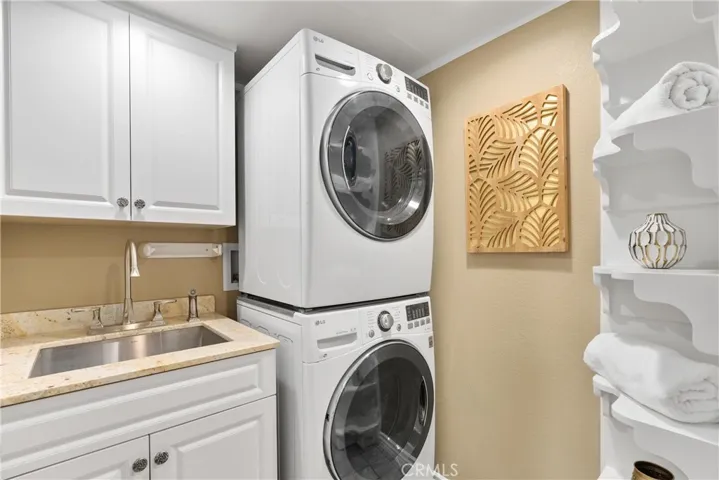 Laundry Room with utility sink and cabinets