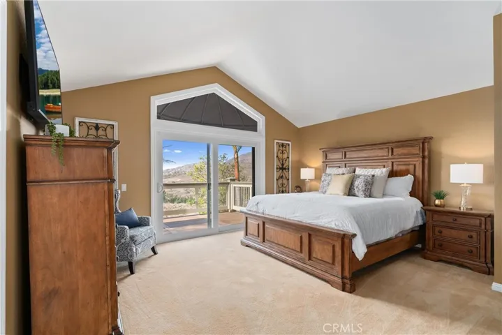 Primary bedroom with slider to large deck with panoramic views.