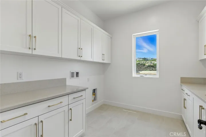 Laundry Room: Silverado Modern Farmhouse - Ridge Collection at Bella Vista - Photo of Homesite 66.