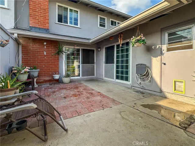 Courtyard and Entrance to Home, Downstairs Bedroom and Laundry Room